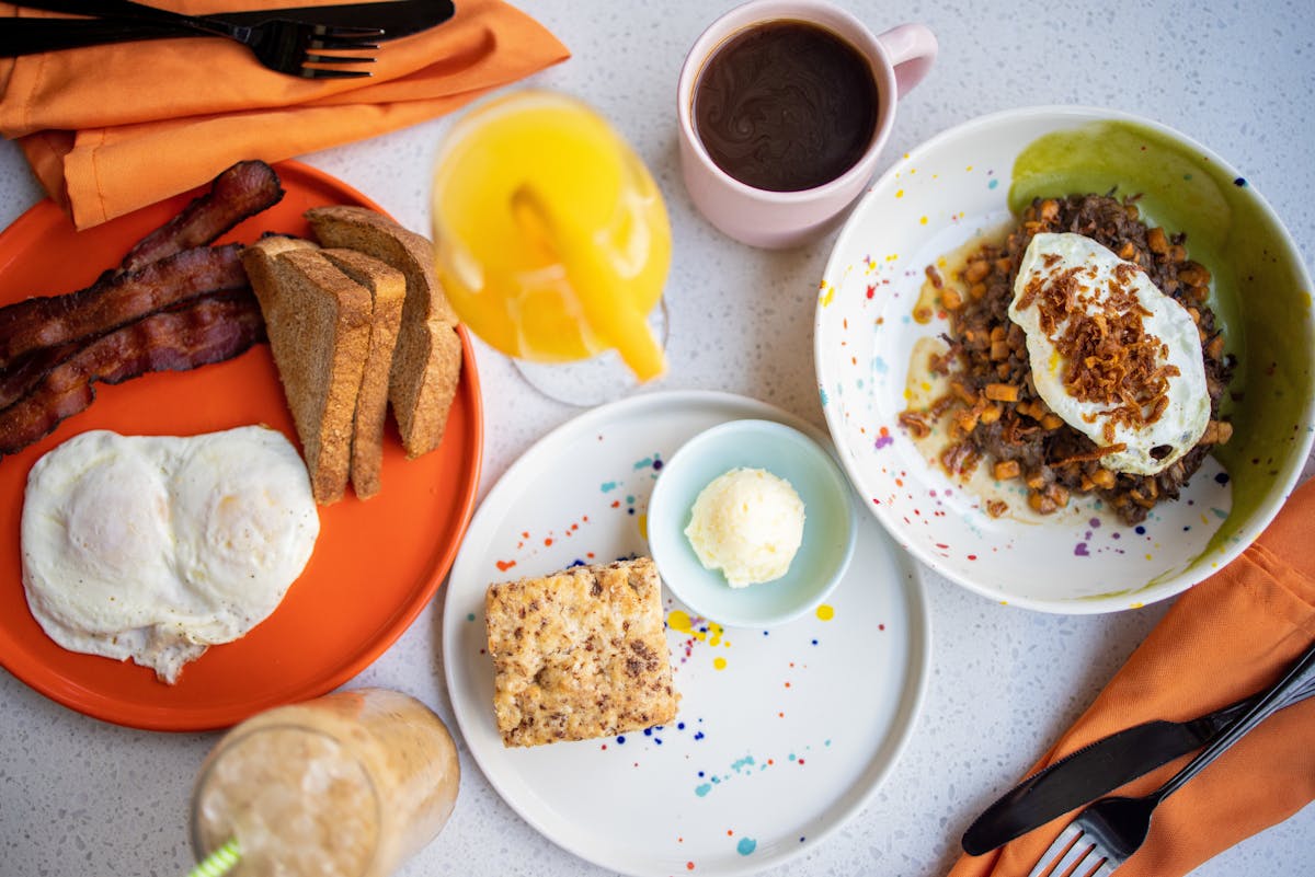 a plate of food and a cup of coffee