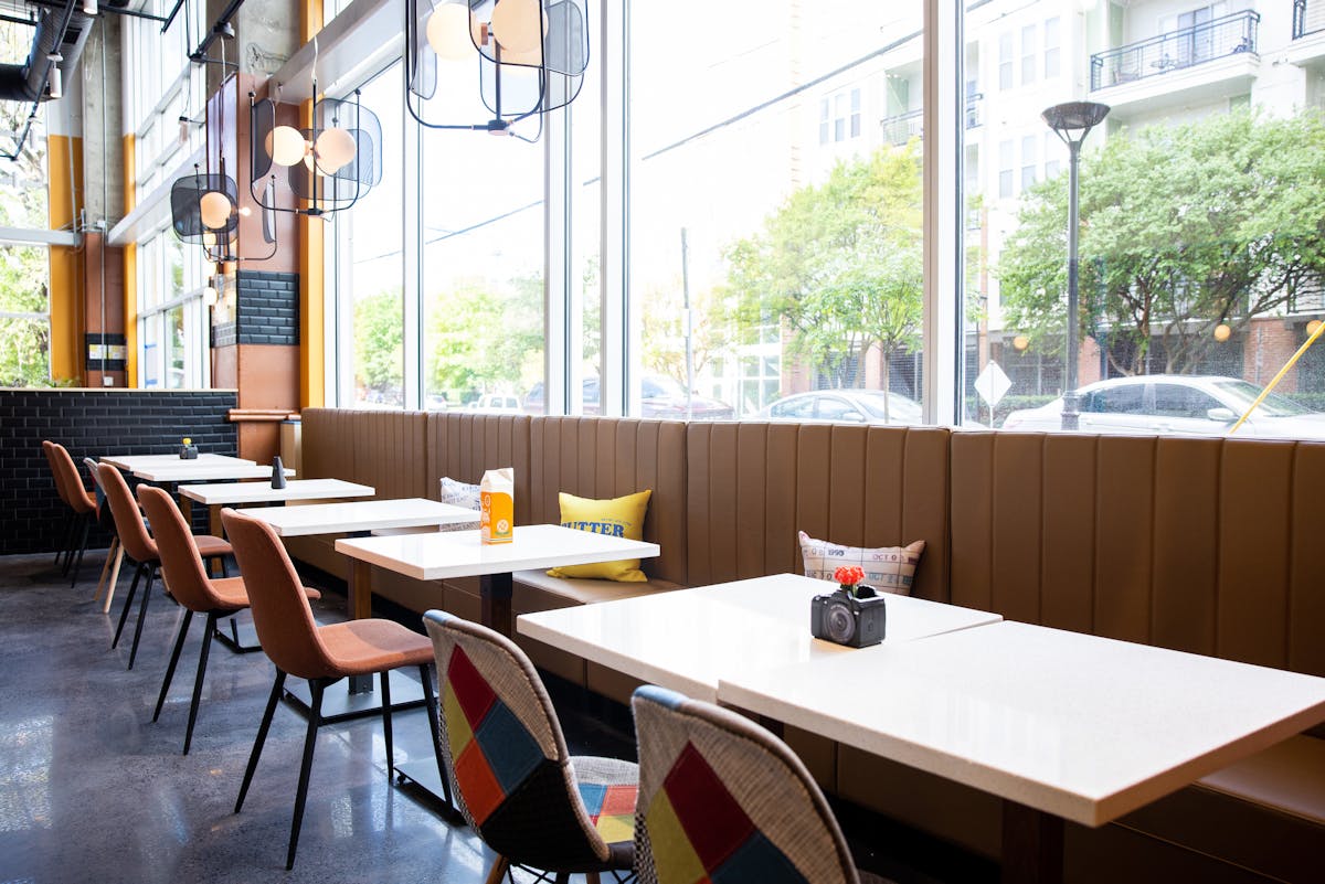 a dining room table in front of a window