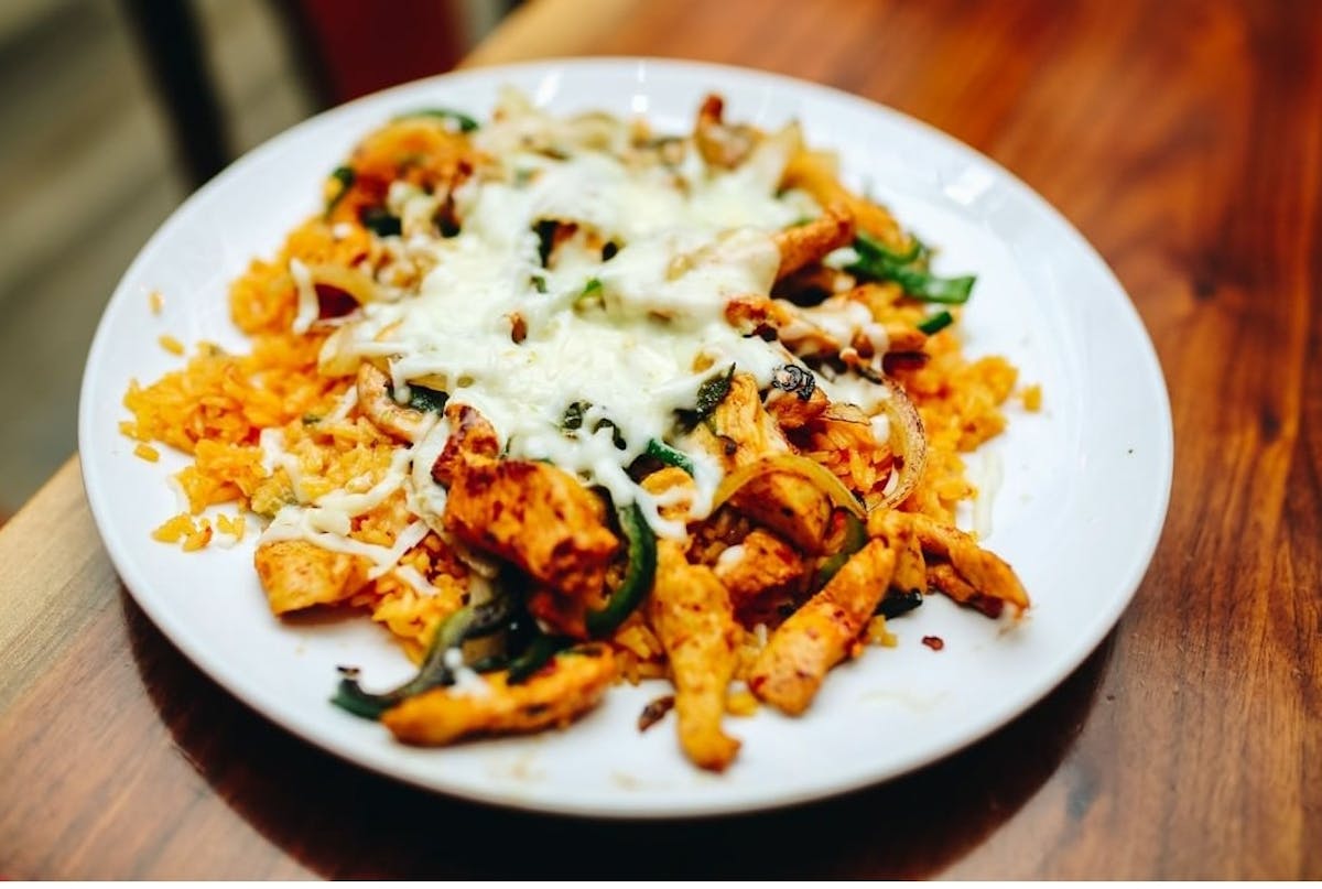 a plate of food on a wooden table