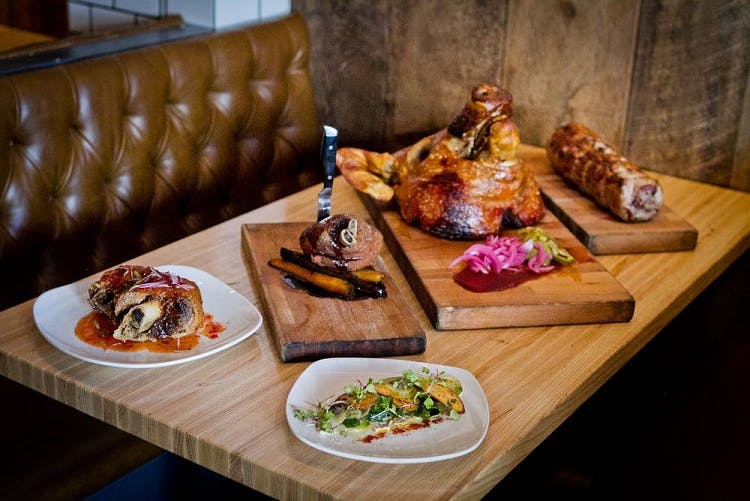 a sandwich sitting on top of a wooden table
