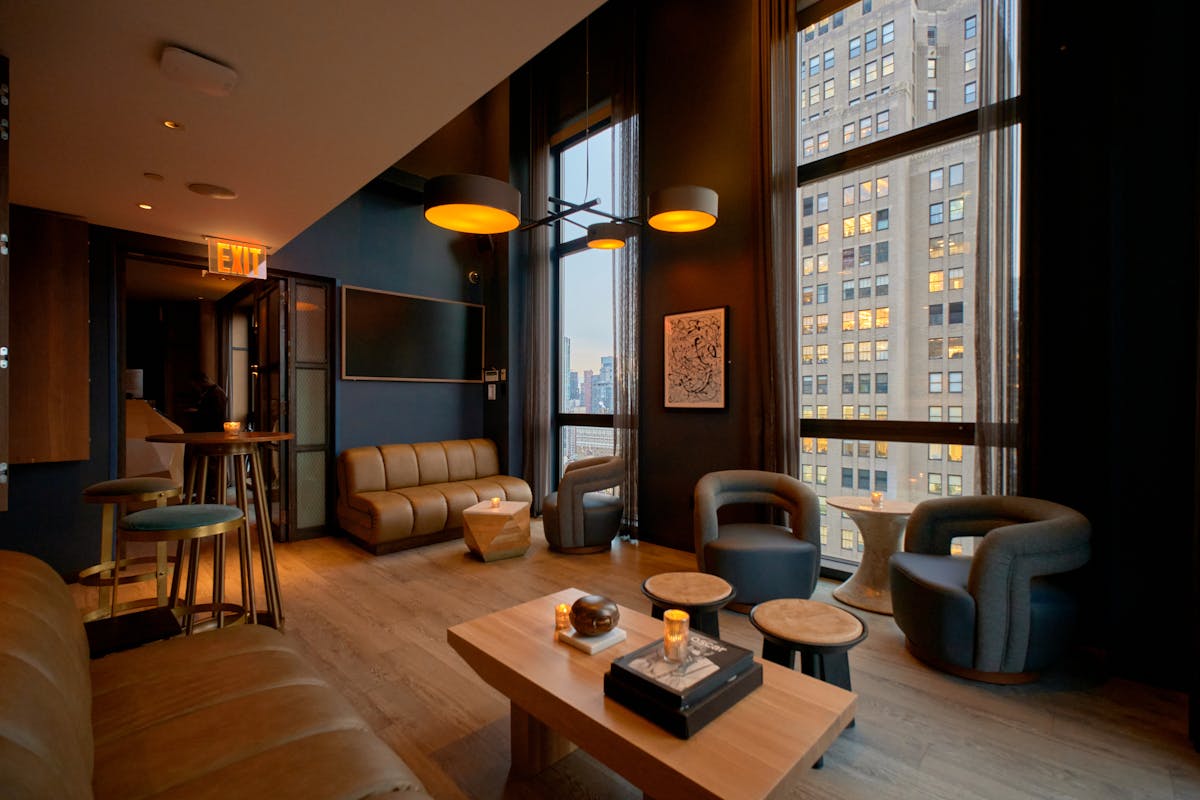 a view of a living room filled with furniture and a fireplace