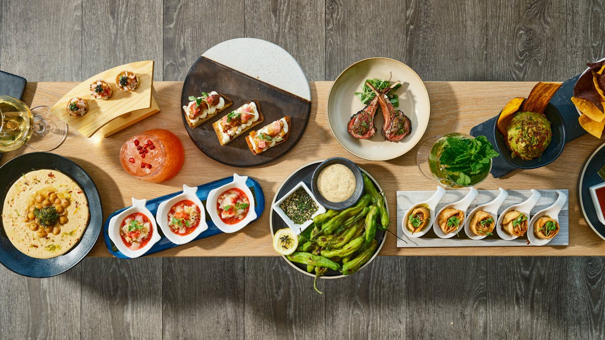 a bunch of food sitting on top of a wooden table