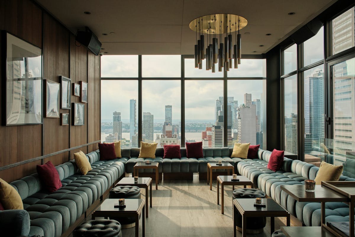 a view of a living room filled with furniture and a large window
