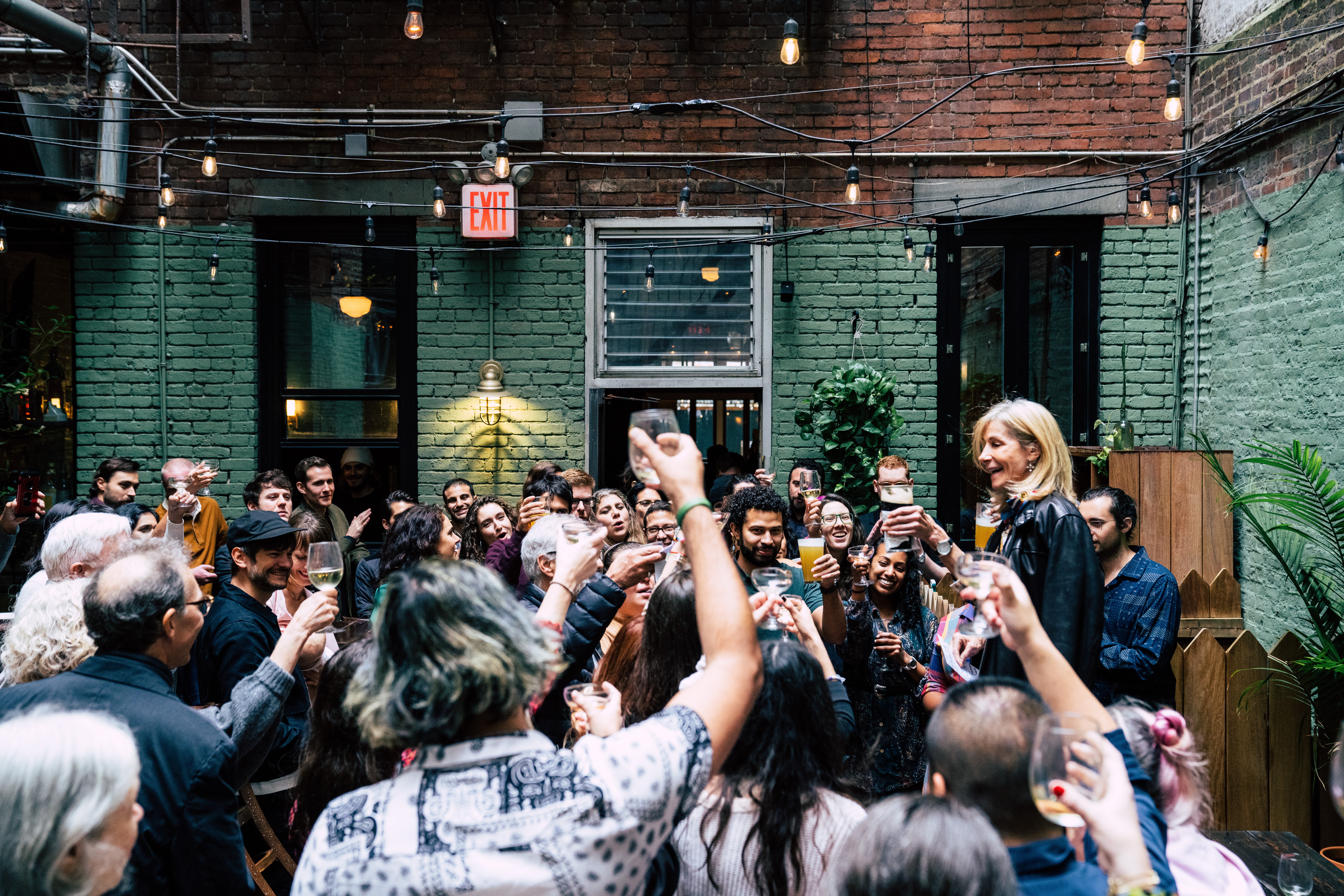 a group of people standing in front of a crowd
