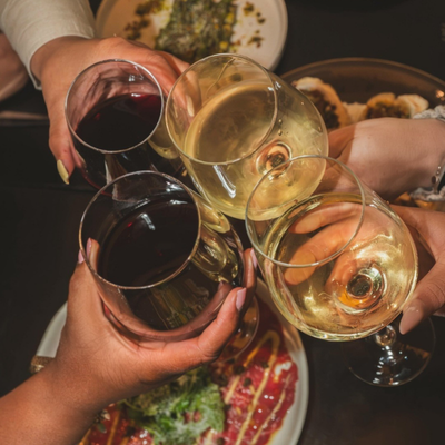a group of people holding wine glasses