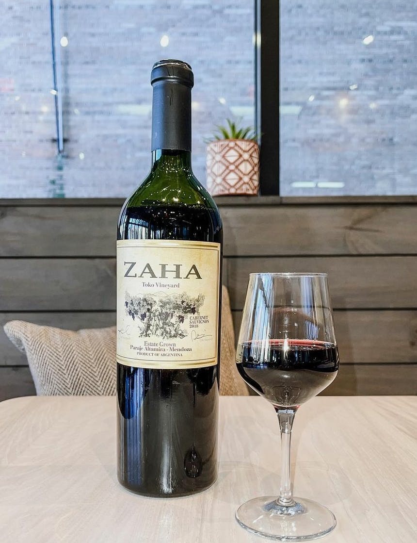 a bottle and a glass of wine