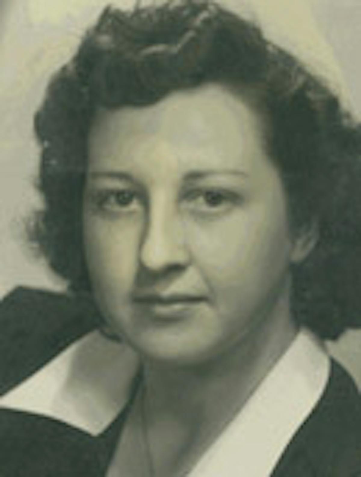 a woman standing in front of a camara