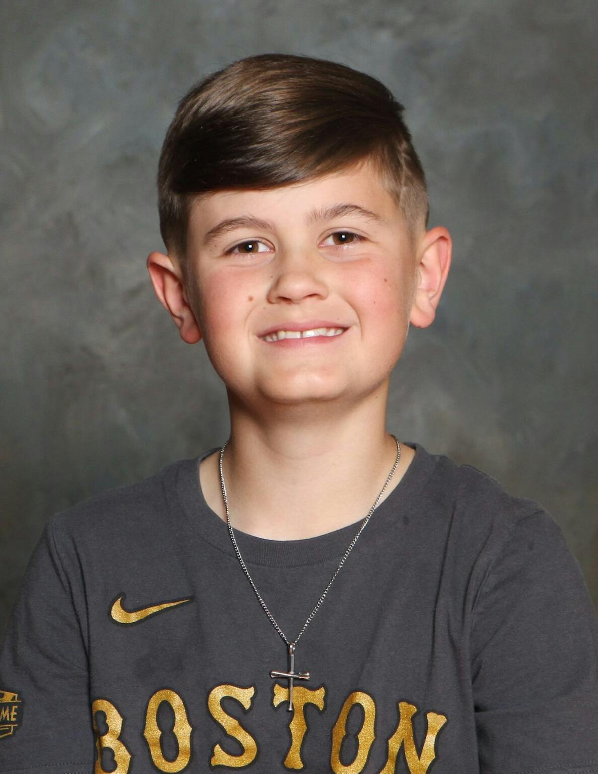 a kid standing in front of a camera