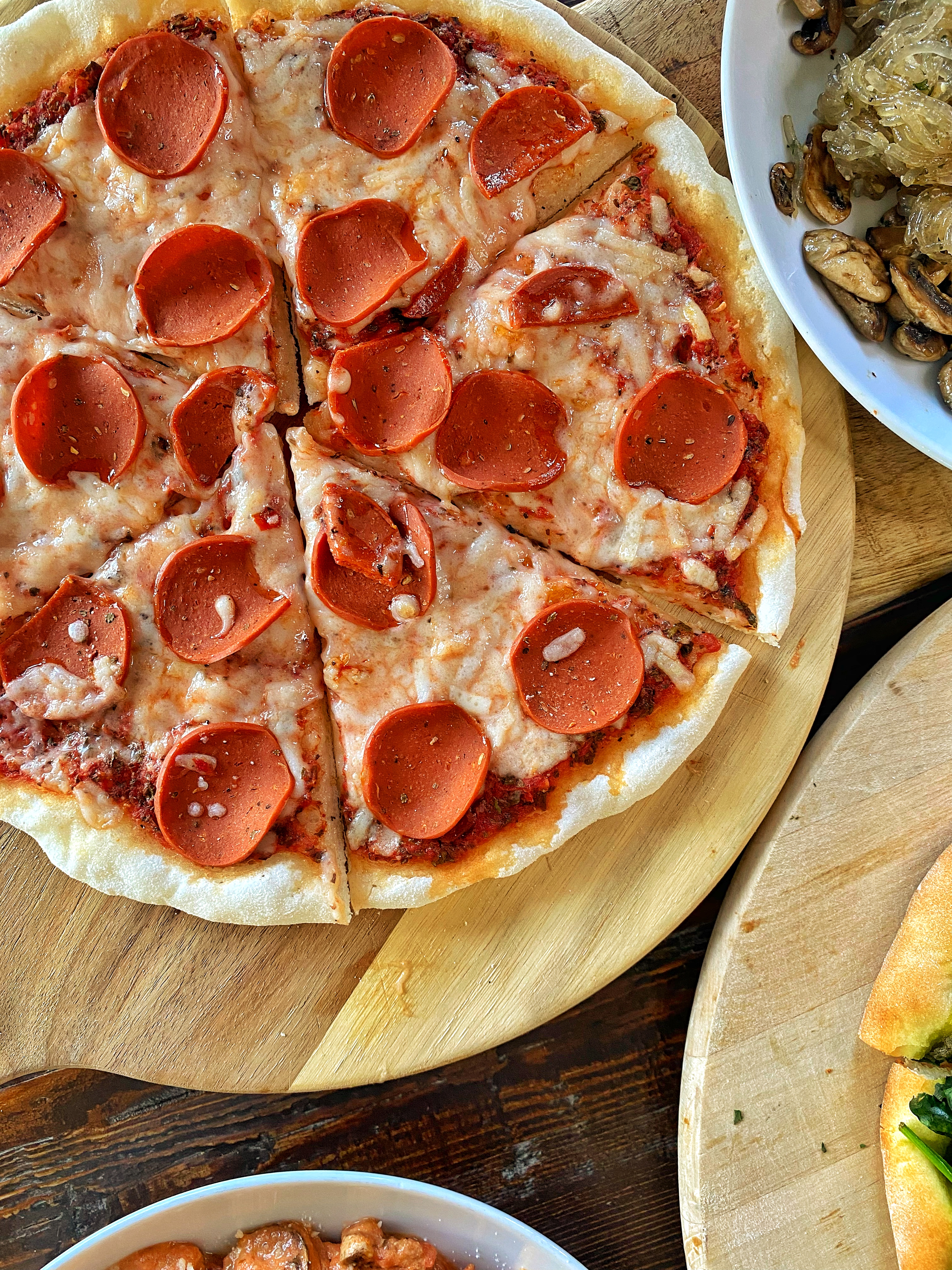 a close up of a pepperoni pizza sitting on top of a table