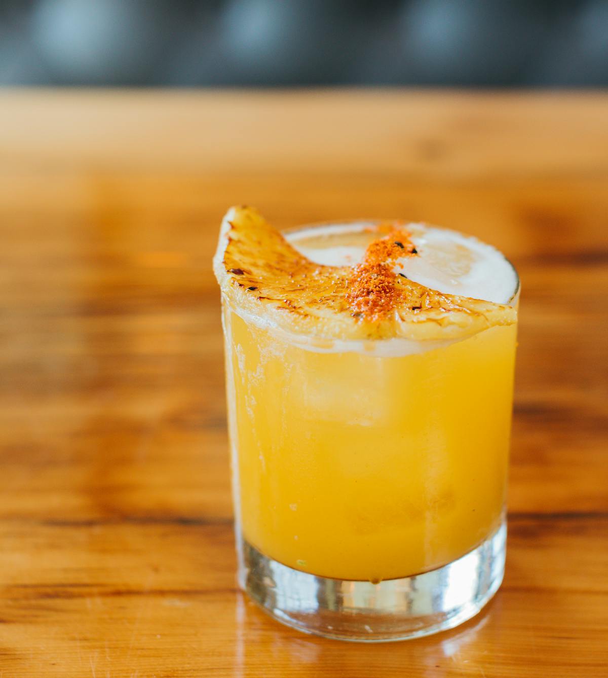 a close up of a glass of orange juice