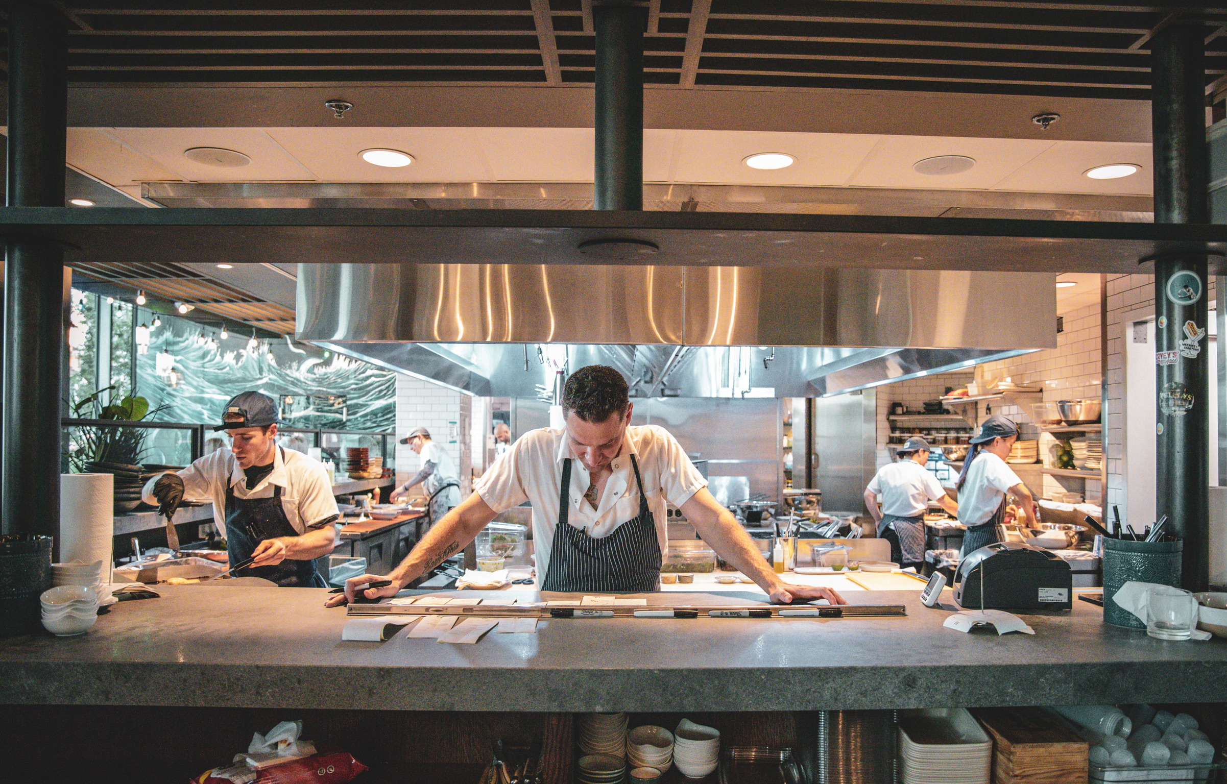 a group of people sitting on a counter