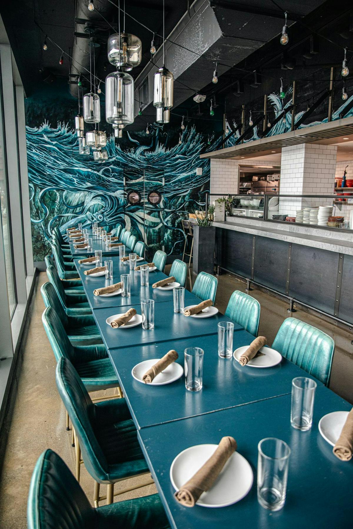 a kitchen with a blue chair