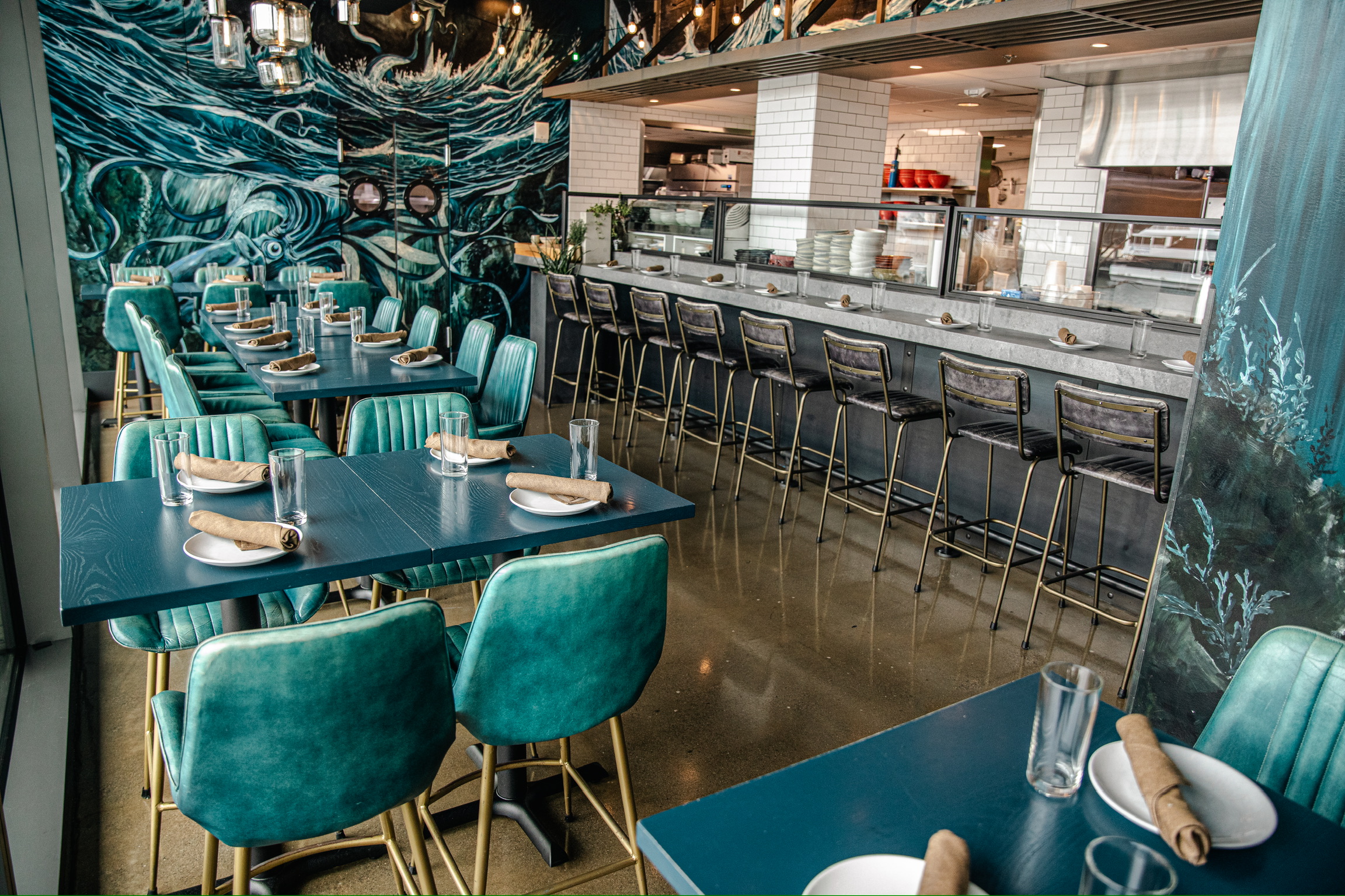 a table topped with a blue chair