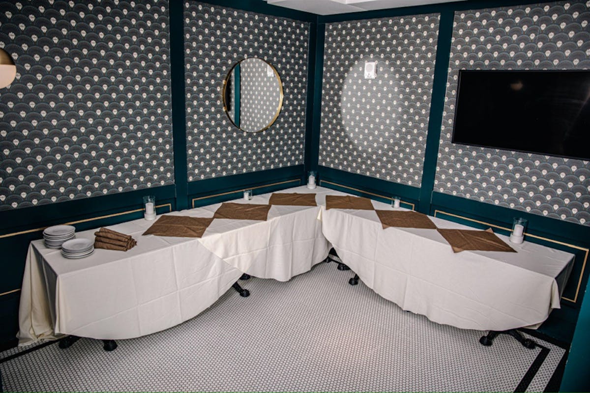 a bedroom with a bed and desk in a room