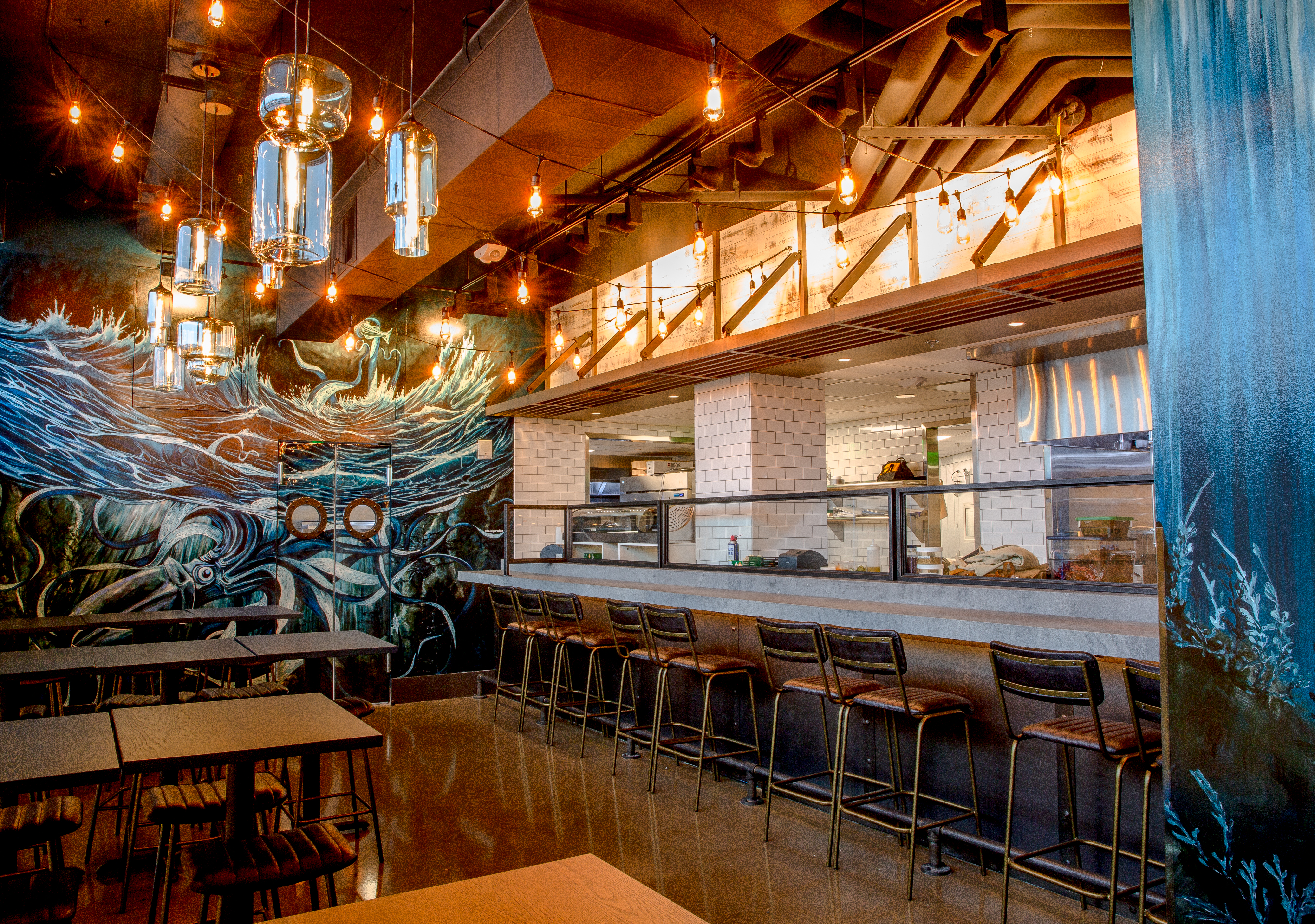 a group of people performing on stage in front of a building