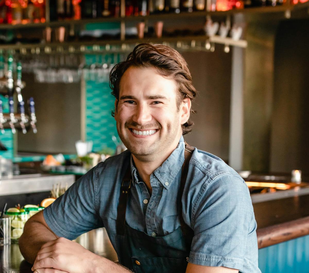a man sitting at a table in a restaurant