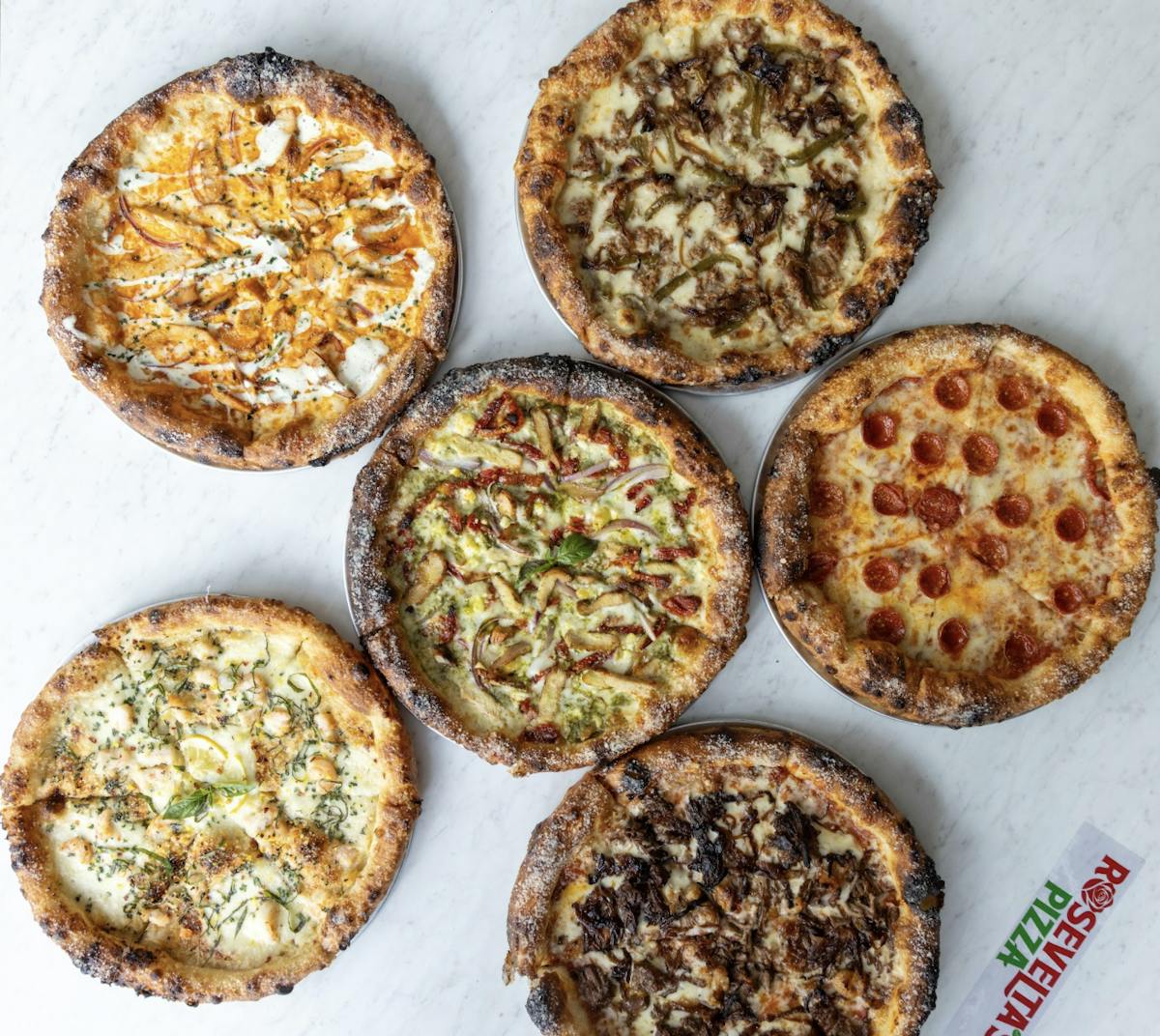 a variety of baked bread on a plate