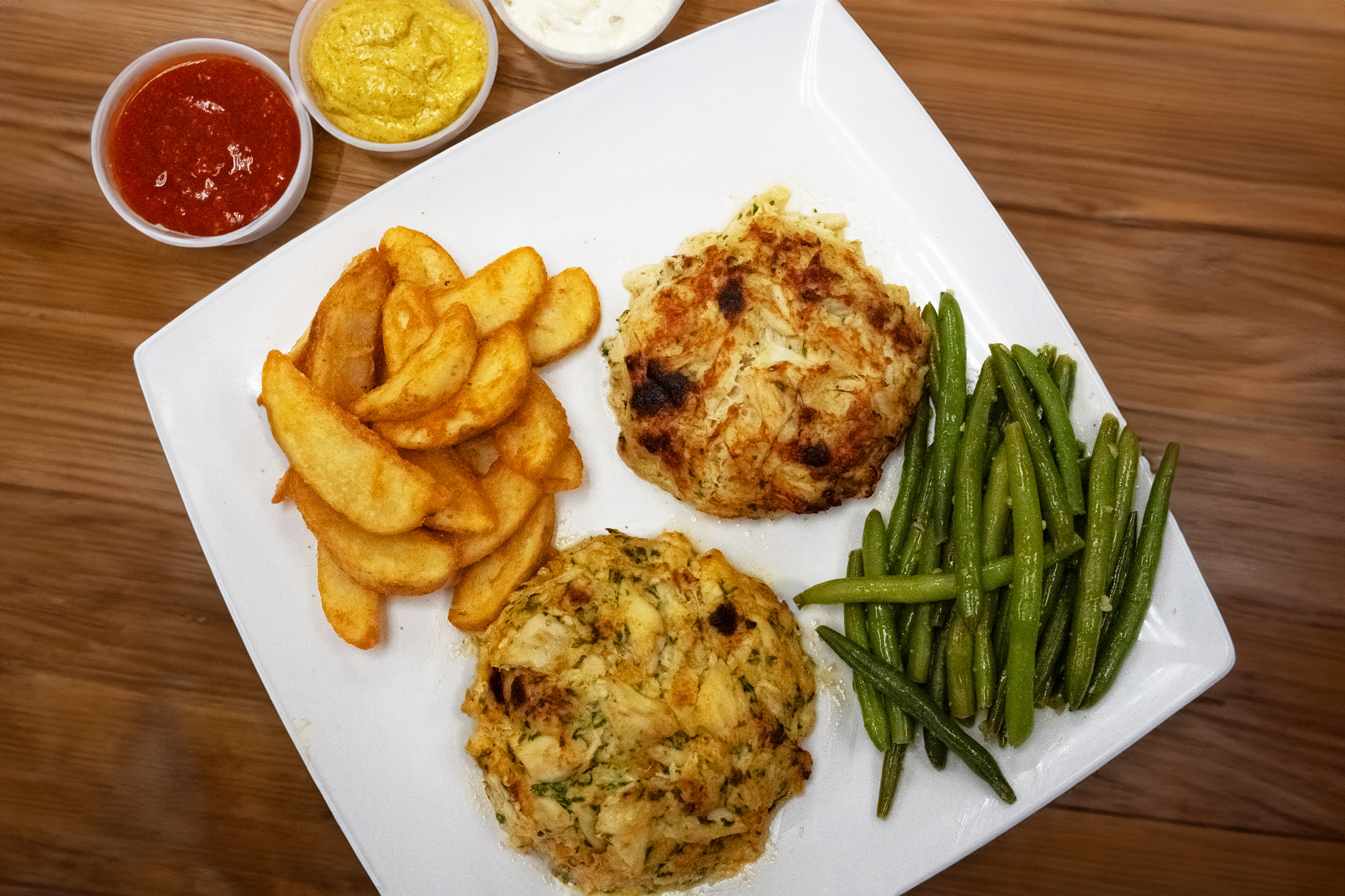 a plate of food sitting on top of a wooden table