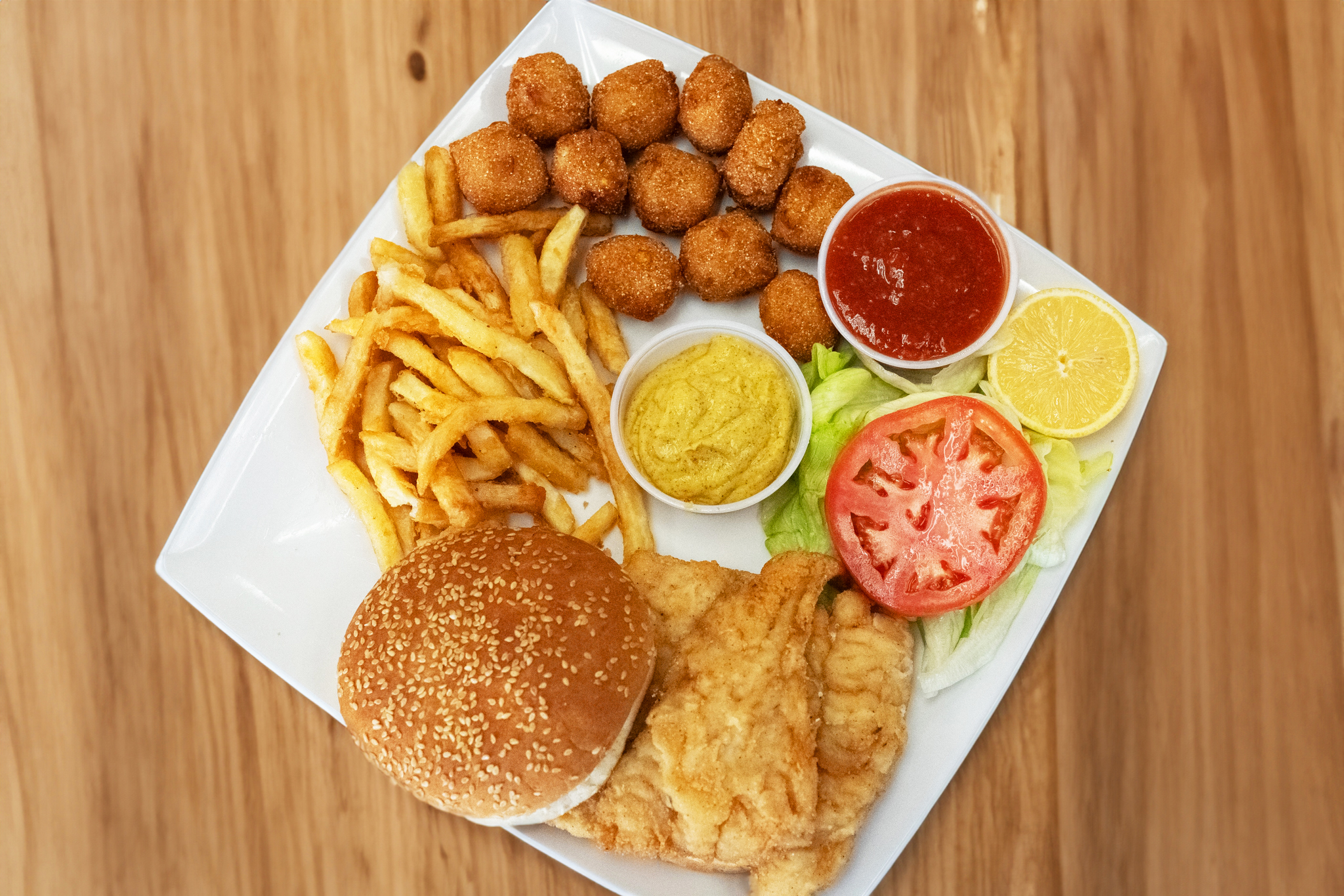 a plate of food sitting on top of a wooden table