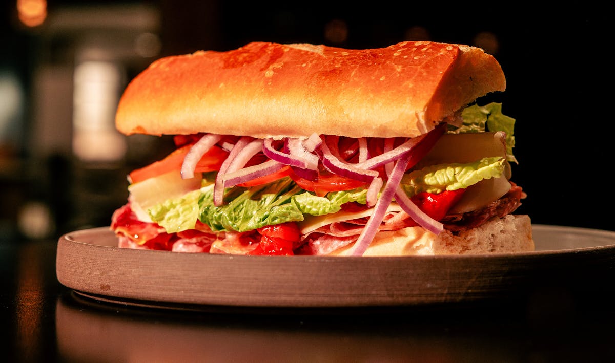 a close up of a sandwich sitting on top of a table