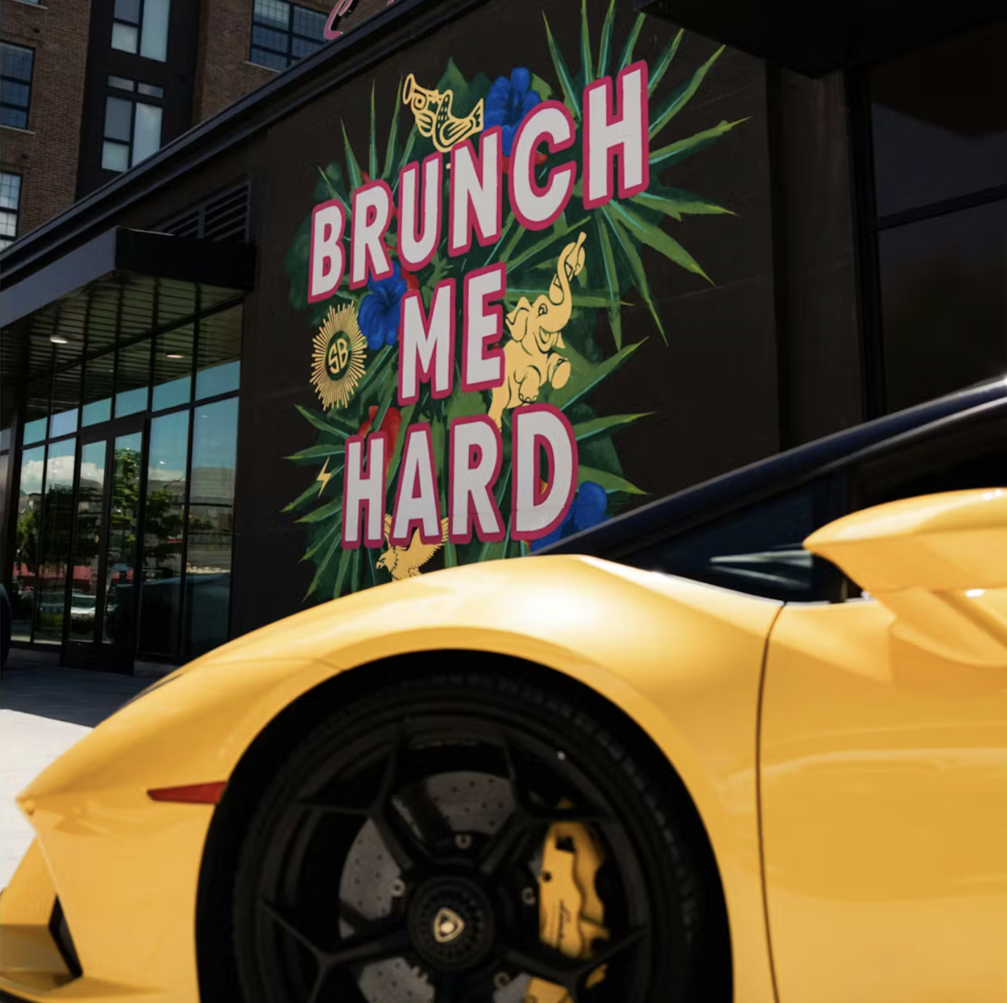 nice car in front of mural