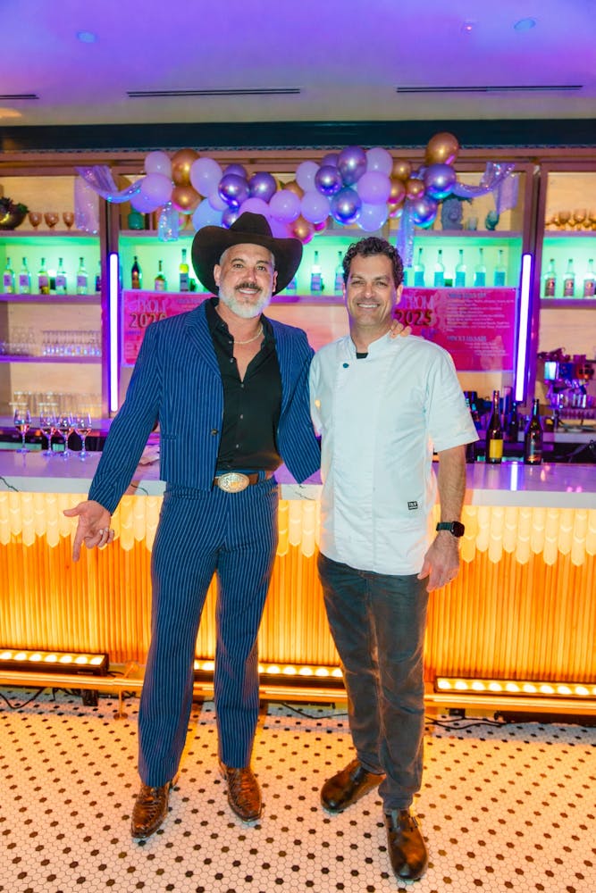 a group of people standing in front of a store
