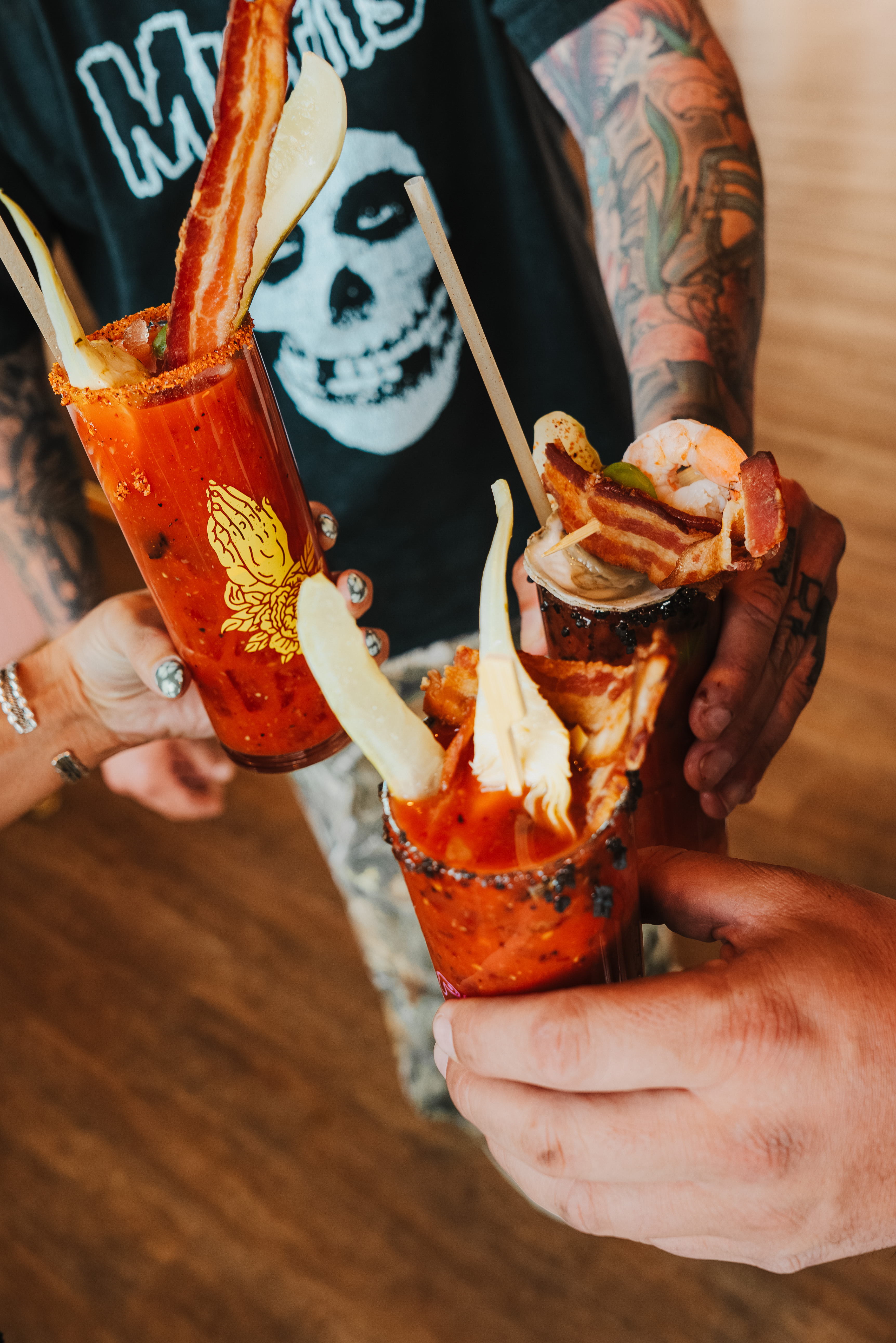 bloody mary drinks in guests hand