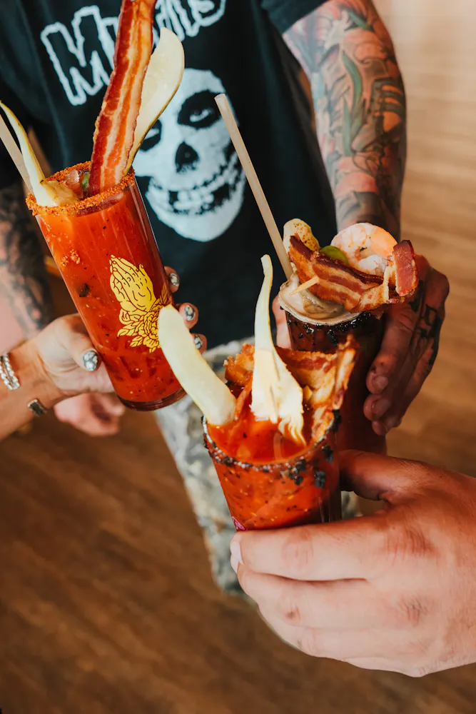 bloody mary drinks in guests hand