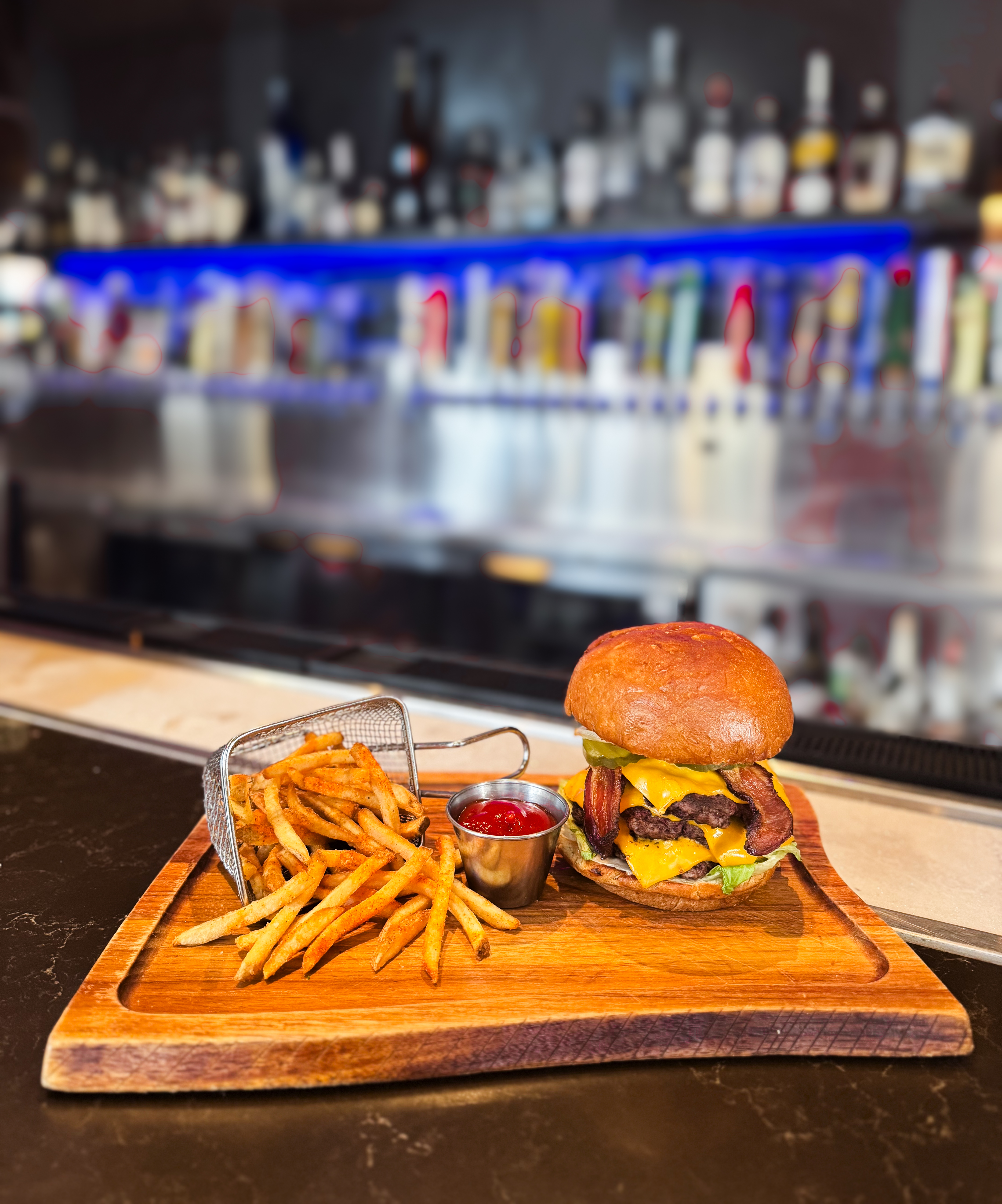 a sandwich sitting on top of a wooden cutting board
