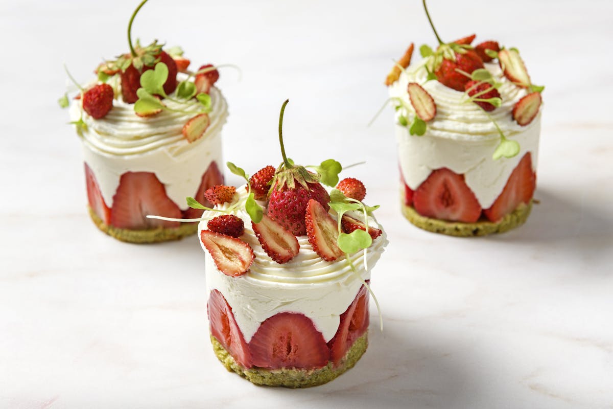 a cake with fruit on top of a table