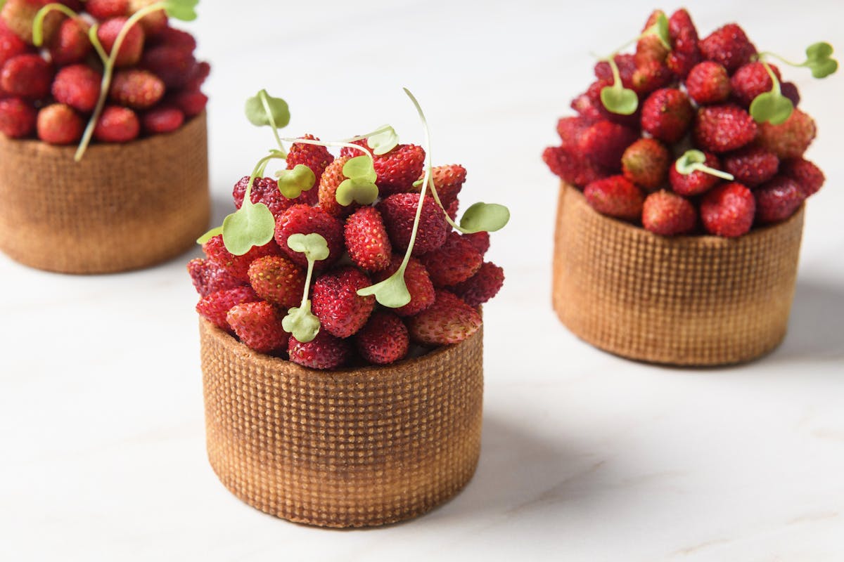 a bowl of fruit on a table