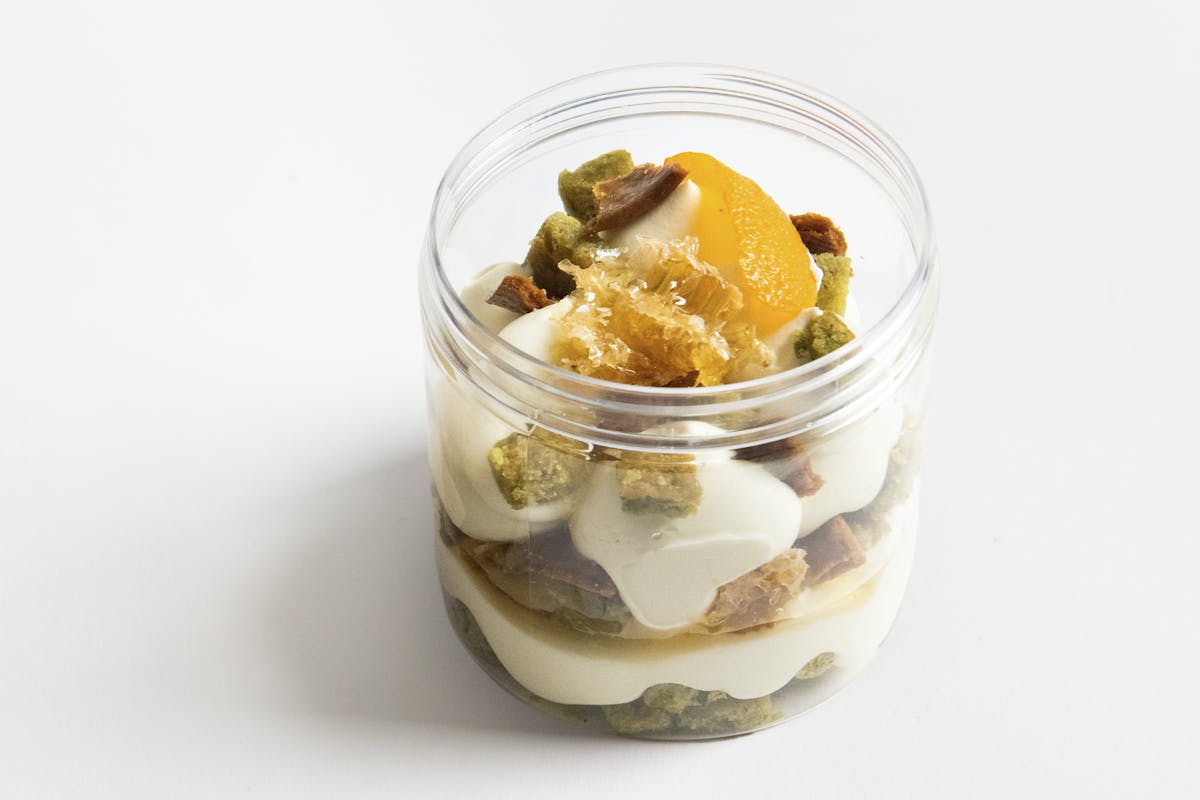 a dessert in a glass cup on a table