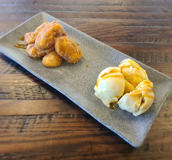 a half eaten banana sitting on top of a wooden table