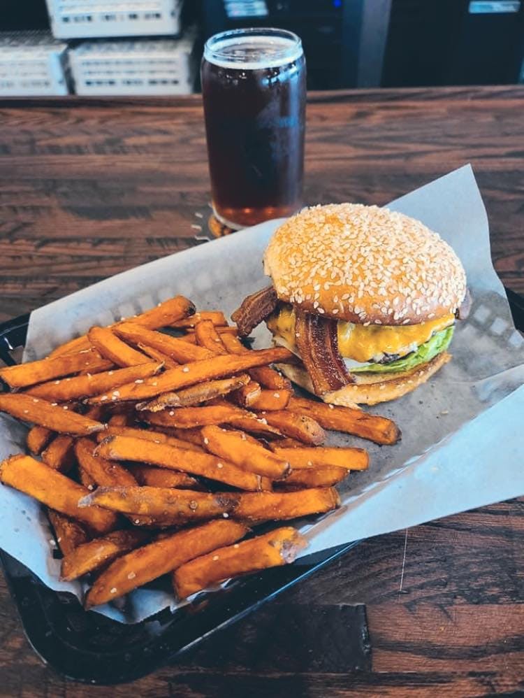 a table topped with a sandwich and fries on a plate