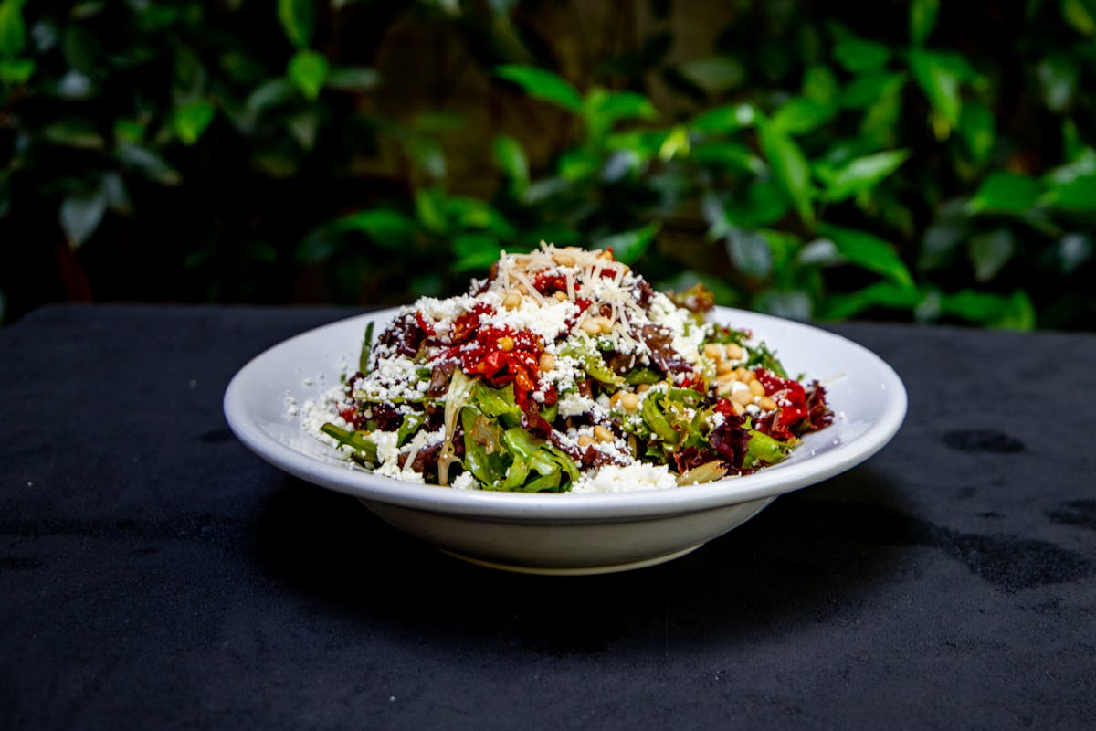 a bowl of food with broccoli