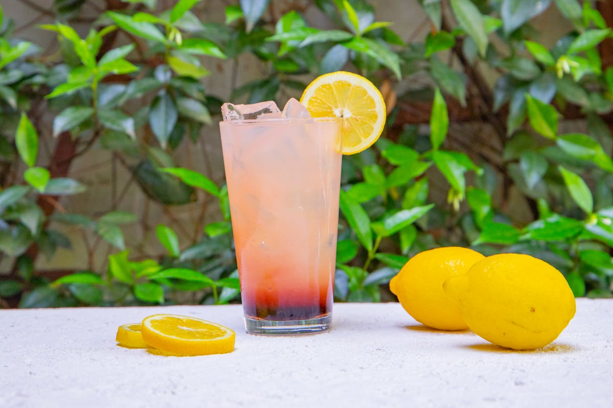 two oranges sitting on top of a table