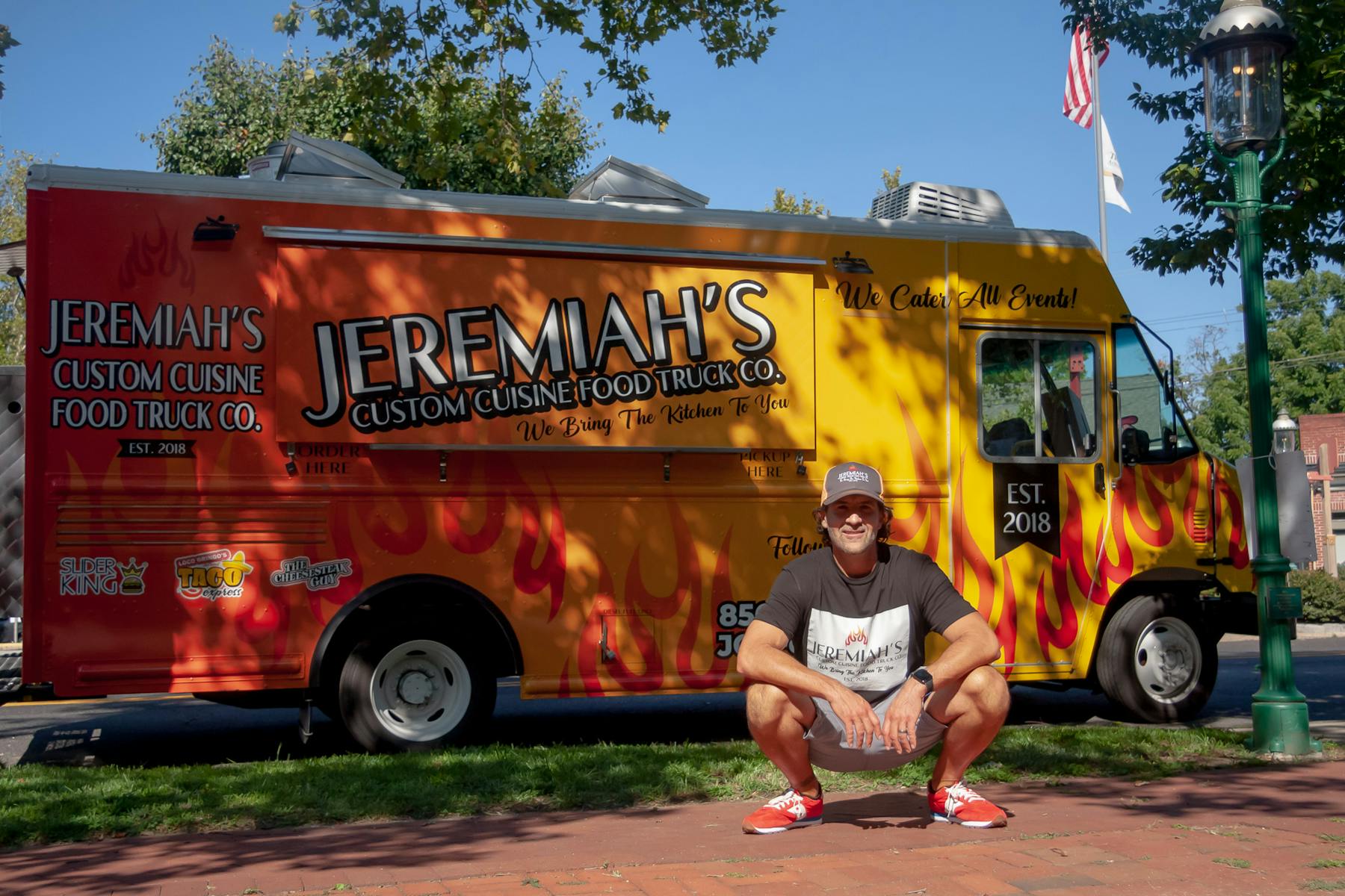 a man standing in front of a fire truck