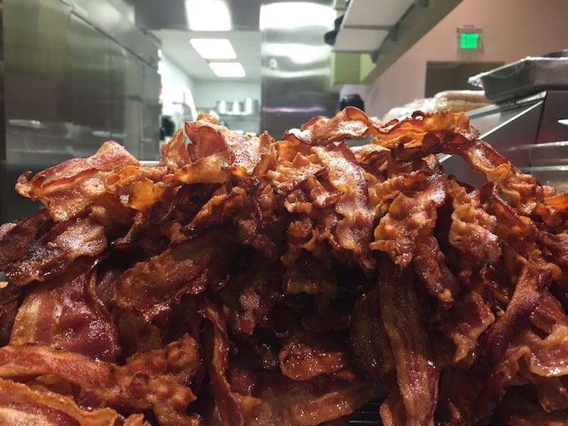a large pile of bacon from simply grand cafe