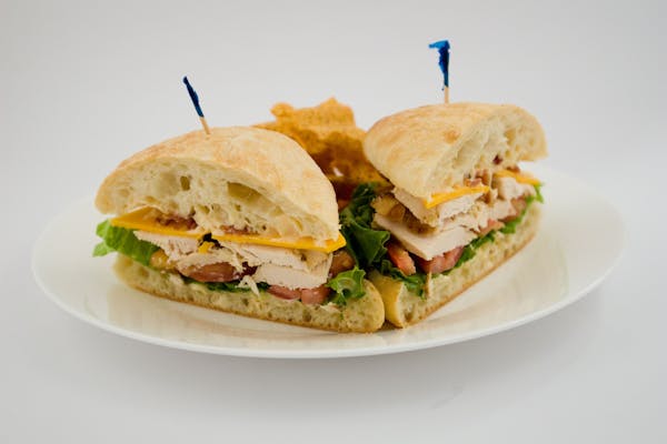 a sandwich and chips on a plate