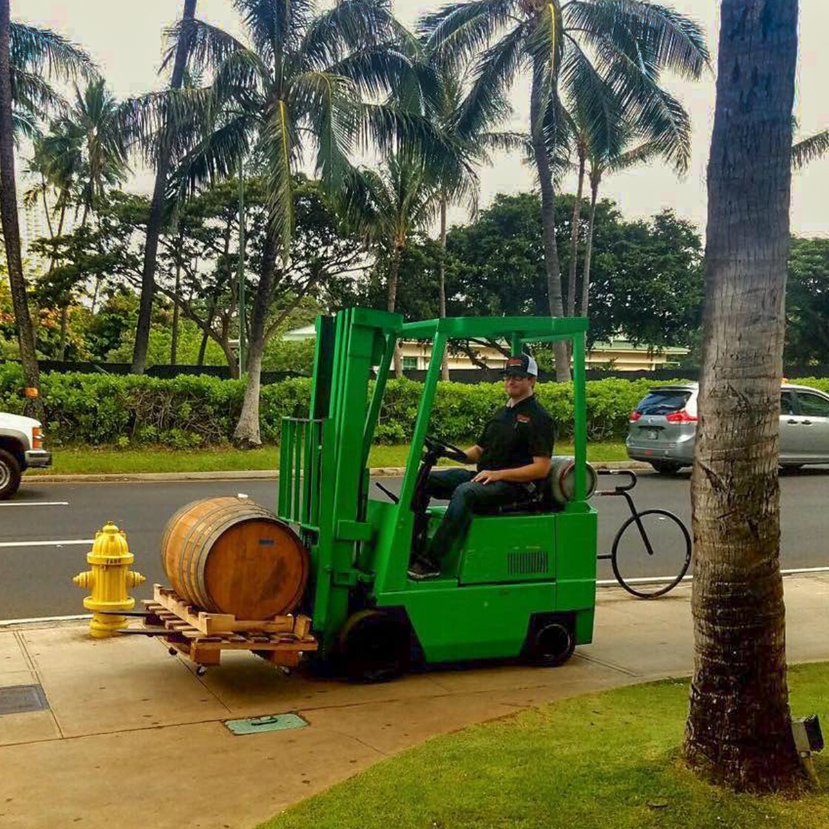 a green truck parked in a parking lot
