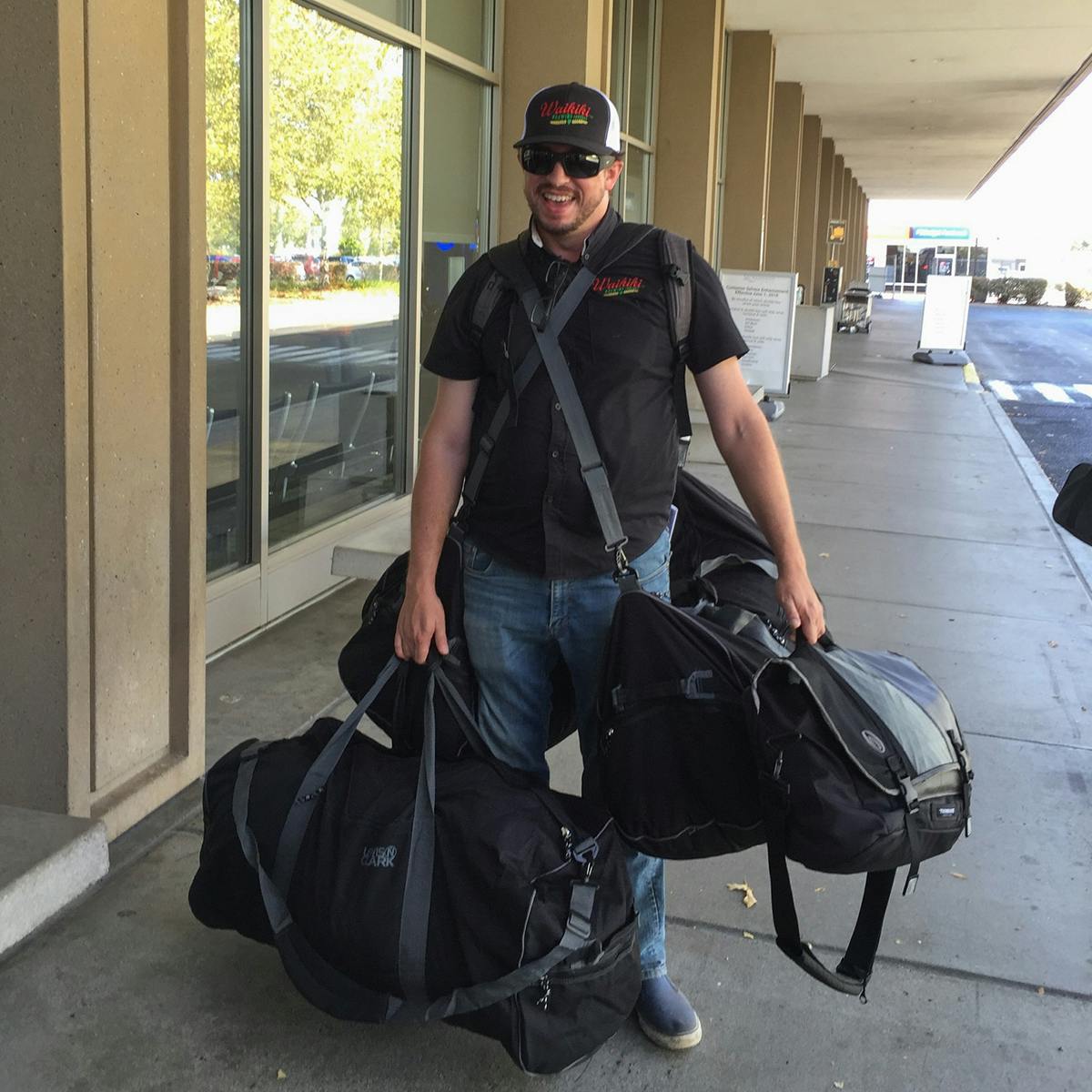 a man holding a bag of luggage