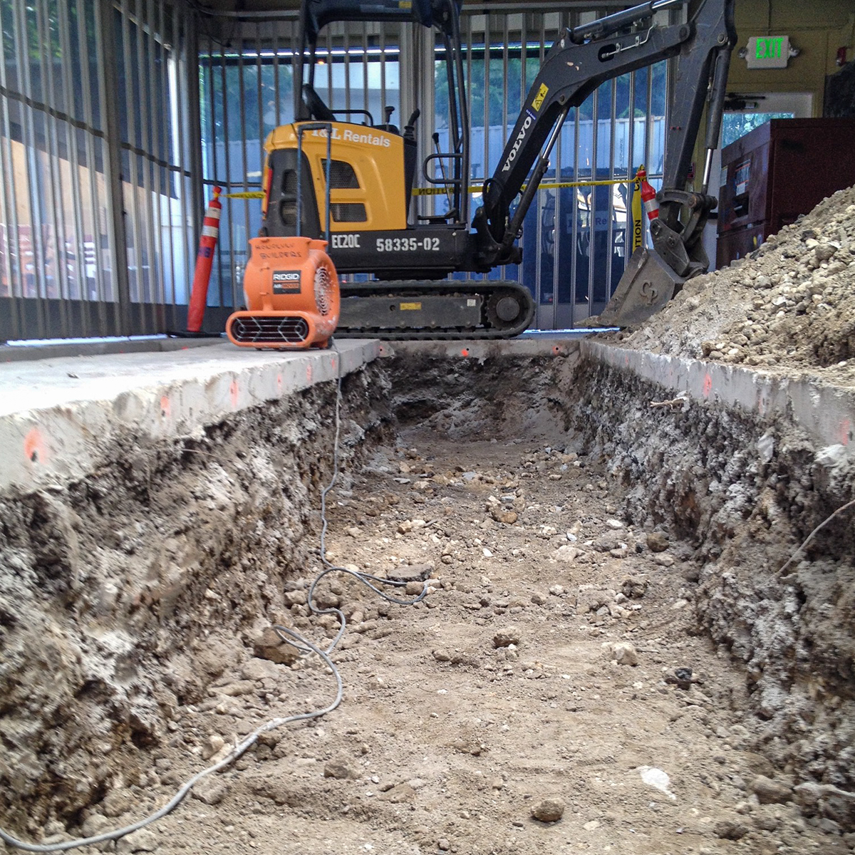 a train is parked on a dirt track