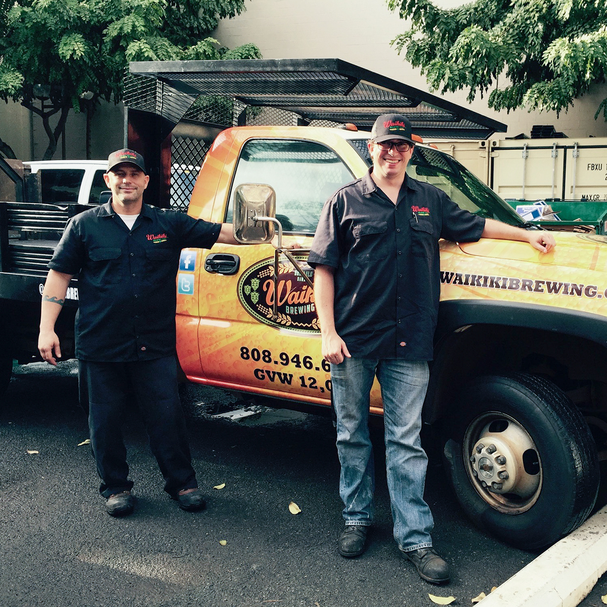 a group of people standing in front of a truck