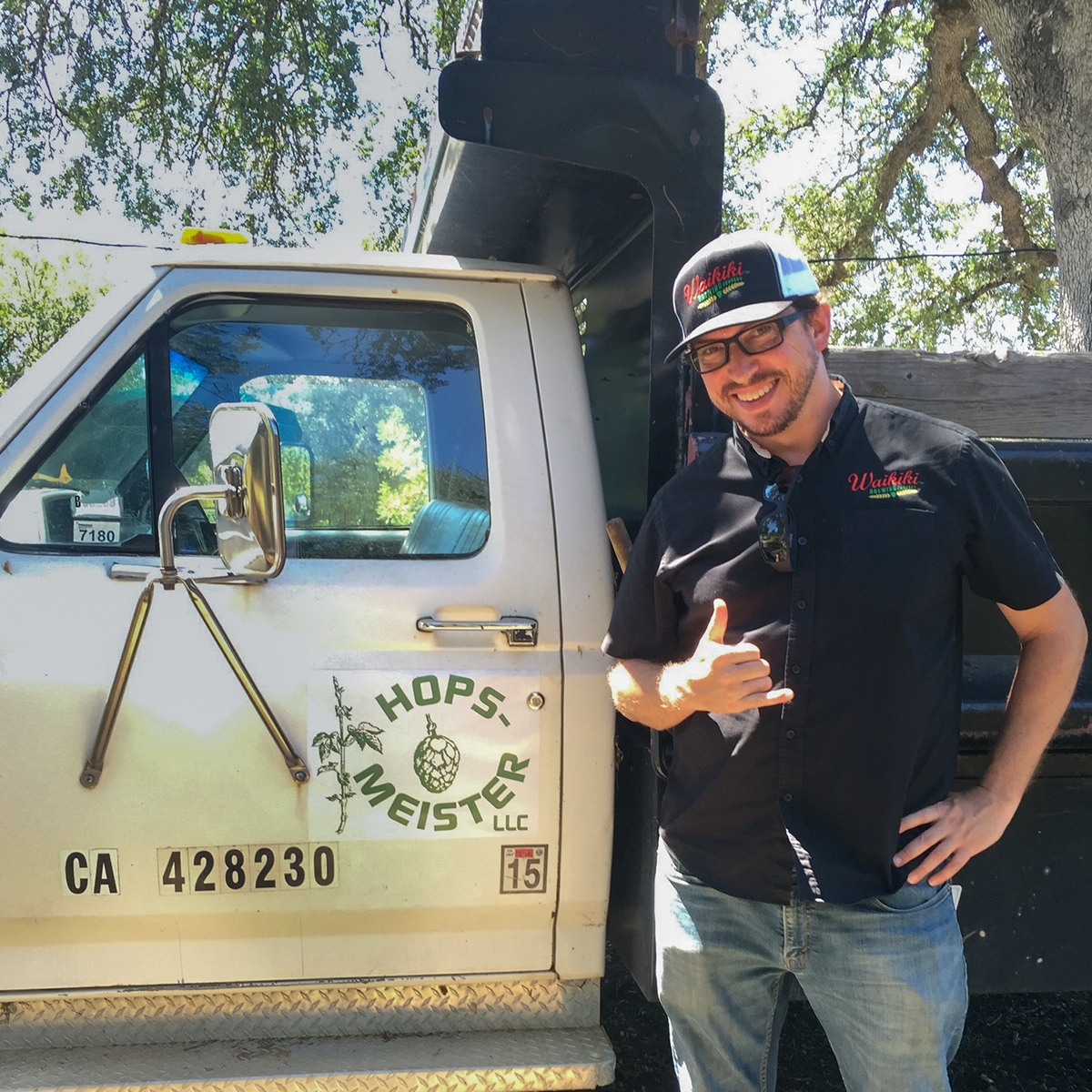 a man standing in front of a car