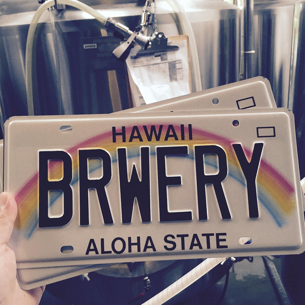 a train cake sitting on top of a sign