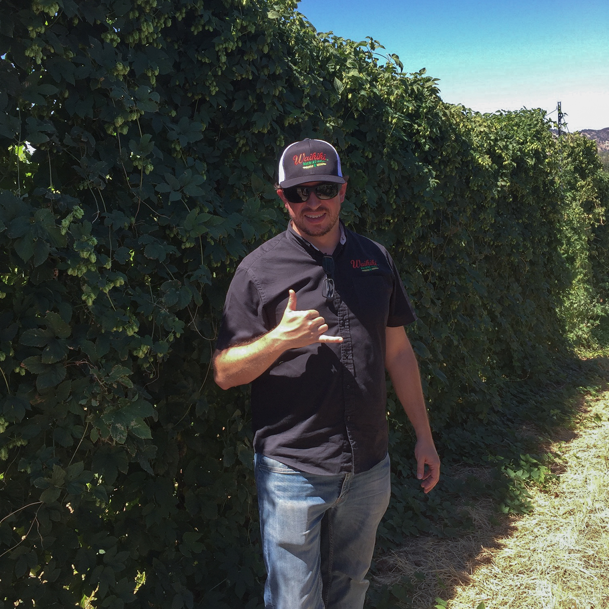 a man standing next to a tree