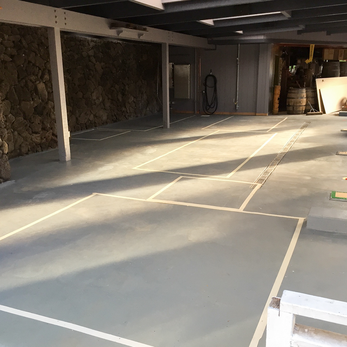 an empty road with a building in the background