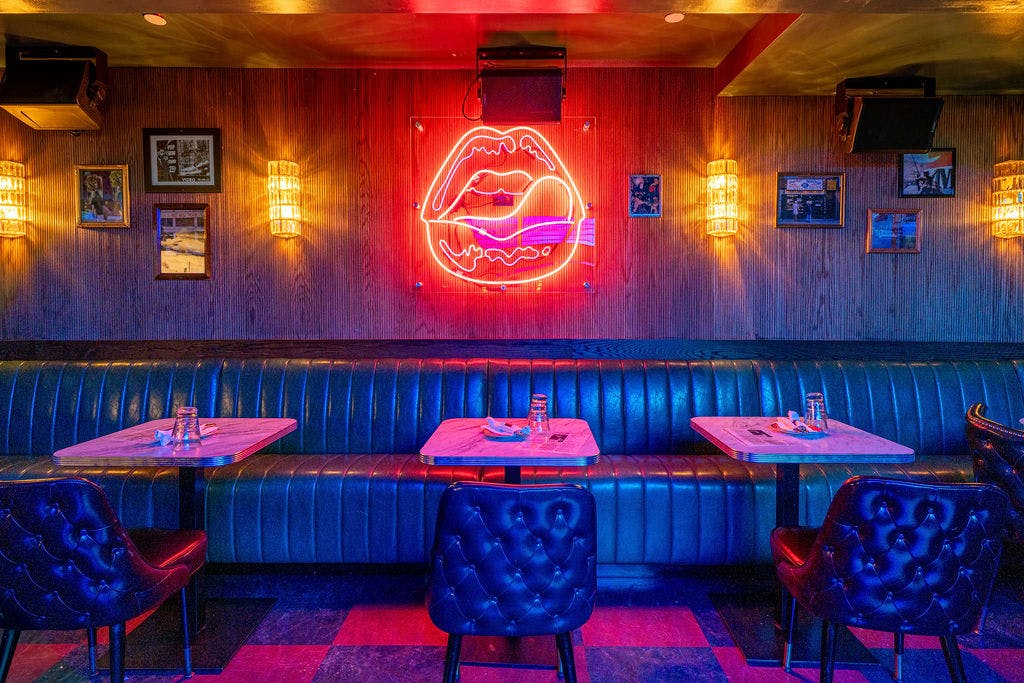 a table topped with a blue umbrella