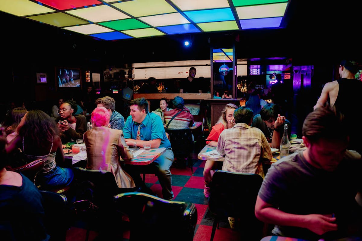 a group of people sitting at a crowded room