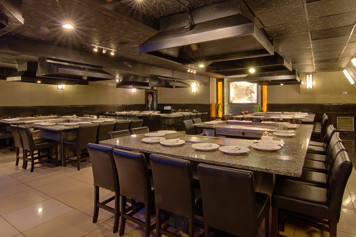 a kitchen with a table in a restaurant